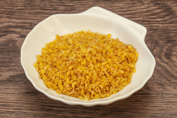 istock Vegetarian cuisine - dry bulgur for cooking 1222221214