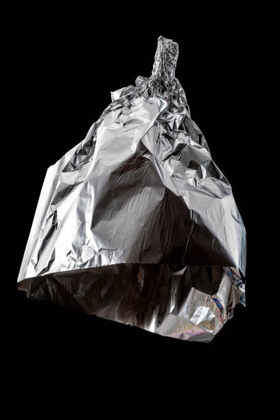 Conspiracy theories, mad pseudoscience and humorous joke concept with tin foil hat isolated on black background with clipping path cutout using ghost mannequin technique Conspiracy theories, mad pseudoscience and humorous joke concept with tin foil hat isolated on black background with clipping path cutout using ghost mannequin technique tin foil hat stock pictures, royalty-free photos & images