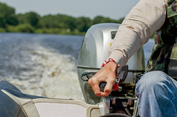 un uomo guida una barca a motore. motoscafo. - speedboat leisure activity relaxation recreational boat foto e immagini stock