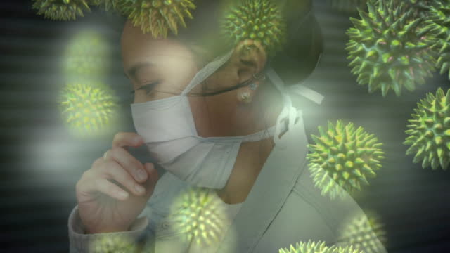 Animation of macro coronavirus Covid-19 cells spreading over an Asian woman wearing a face mask