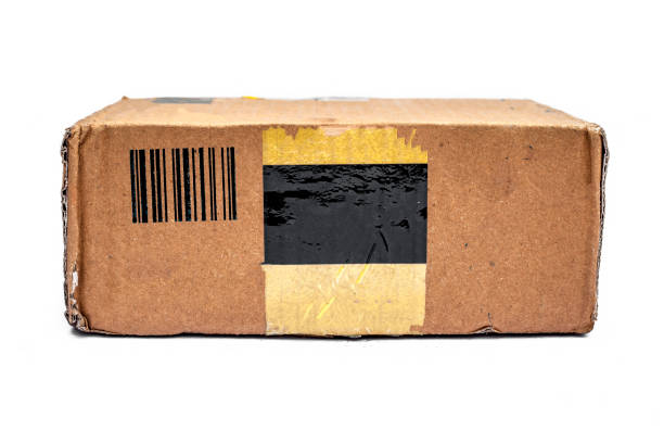 istock Brown colored cardboard wrapping box container isolated on white. Horizontal shot of brown packing box isolated. 1222230058