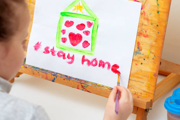 istock Child writes words Stay Home. 1222230786