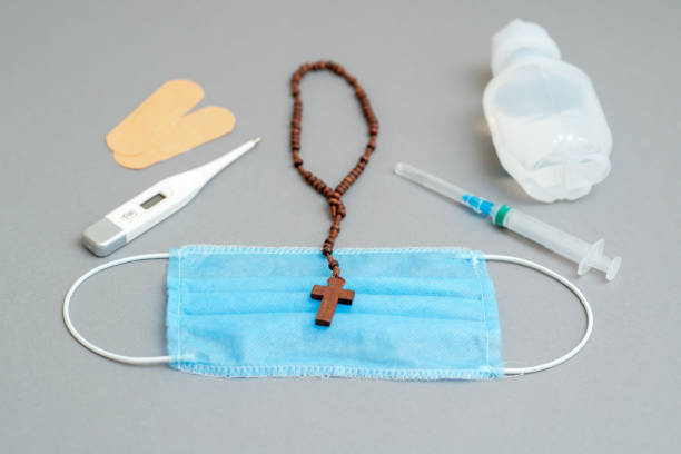 istock Medical mask with catholic cross. 1222231573