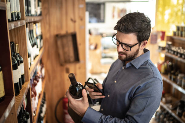 istock Mid adult man customer buying using mobile phone at store 1222233268