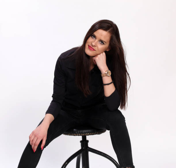 istock Attractive caucasian brunette girl posing in studio on isolated background. 1222235131