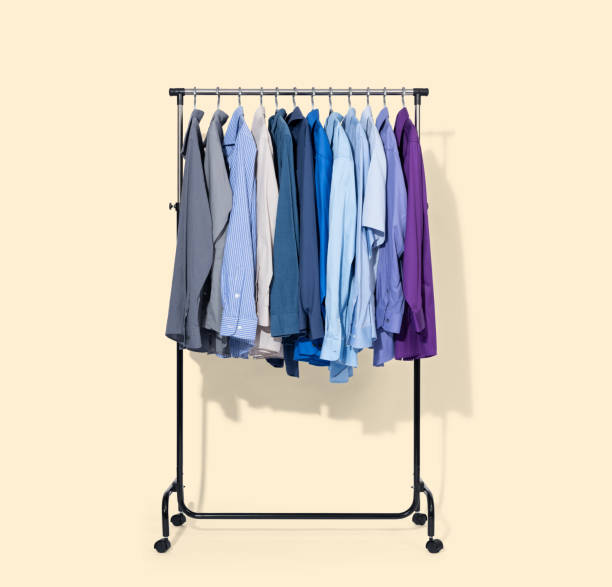 istock Mobile rack with shirts isolated on light yellow background. File contains a path to isolation. 1222235133