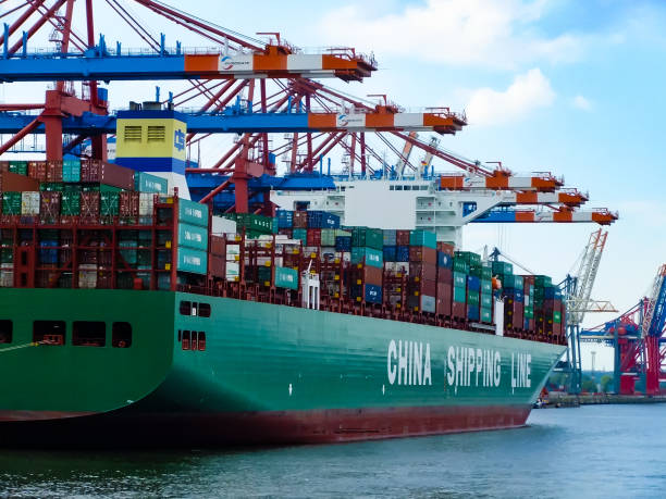 cargo containers at a commercial dock terminal at hamburg harbor, germany - harbor cargo container commercial dock container imagens e fotografias de stock