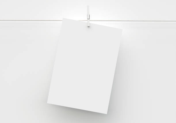 istock A4 Paper Sheet Mockup Hanging on Rope. 3d Render 1222238597