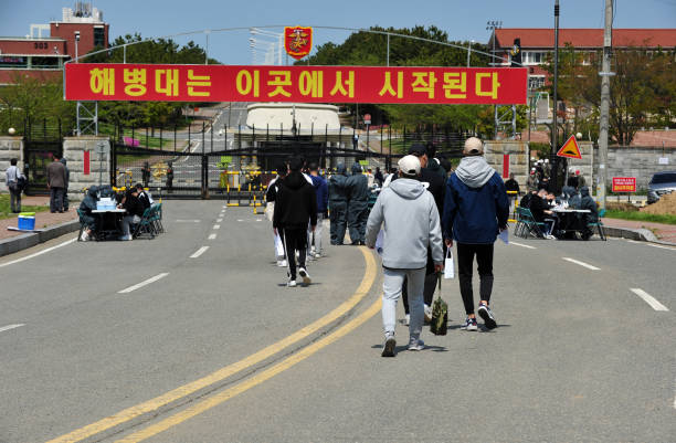 Korean young people entering Marine Corps Education and Training Center. stock photo