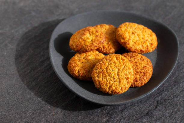 istock coconut cookies on dark dish on ceramic background 1222239450