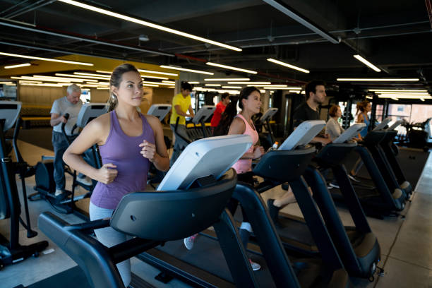 istock Group of fit people exercising on the treadmills 1222240236