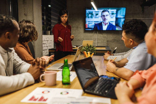 istock Office administrator passing the message from manager on videoconference to her team 1222240966