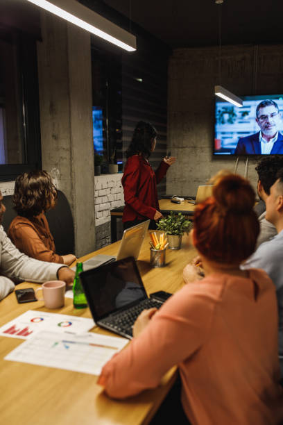 Late long meeting with a head manager and team leader doing a videoconference