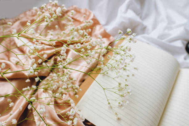 istock Gypsophila flowers with notebook. 1222242399