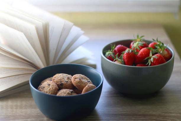 istock Cookies, Strawberries and Book 1222242650