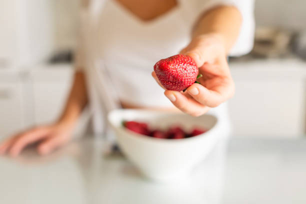istock Woman with empty plate on the kitchen table and eggs ready cooking breakfast 1222242708