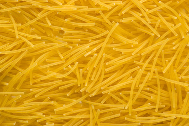 Different types of pasta in small bowls on a table