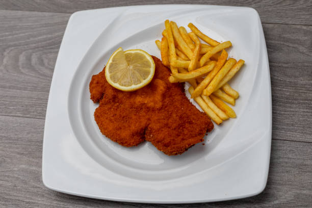 istock Breaded viennese schnitzel with french fries 1222243726