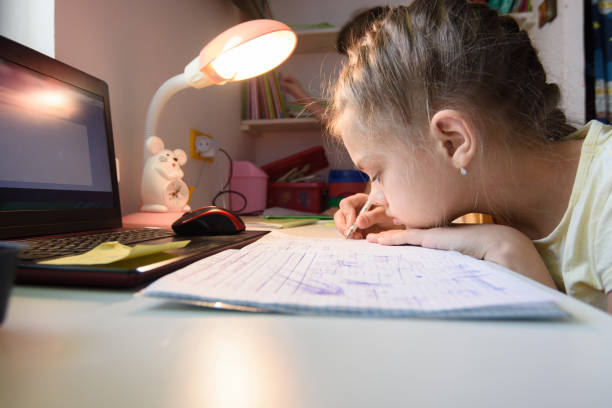 istock The girl is studying at home remotely while in her room 1222243812