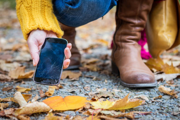 istock Broken smartphone in female hand on street 1222243839