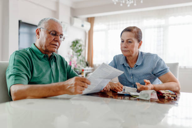 istock Senior couple at home with many bills 1222244604