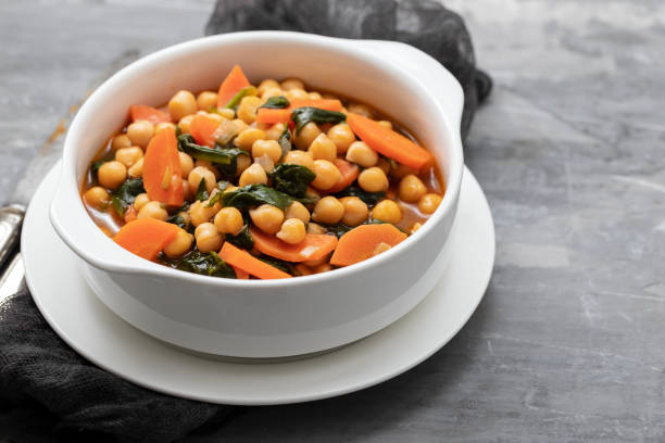 istock chick-pea with carrot and spinach on white bowl on ceramic backgeound 1222246255
