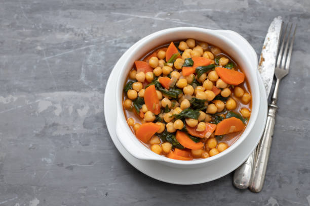 istock chick-pea with carrot and spinach on white bowl on ceramic backgeound 1222246256