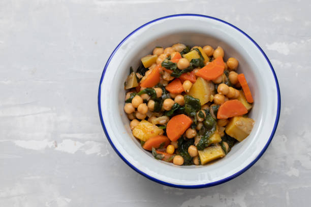 istock chick-pea with carrot and spinach on white bowl on ceramic backgeound 1222246259