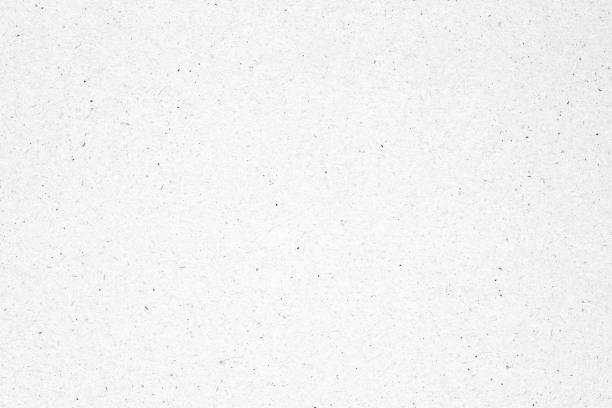 istock White paper or cardboard texture background with black spot. 1222246646