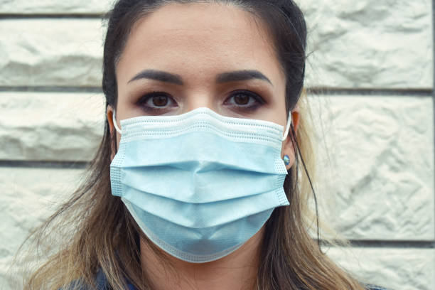 istock Woman outdoors with a face mask 1222247221