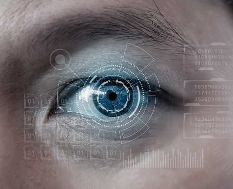 Close up of man eye in process of scanning,human being futuristic vision, vision and control and protection of persons, control and security in the accesses.Concept of: dna system.