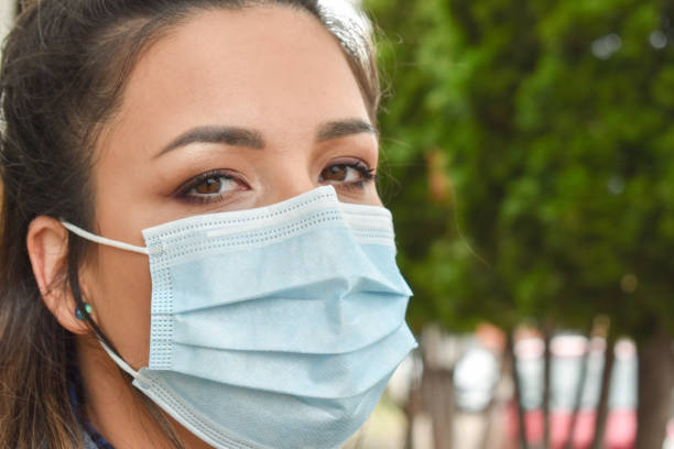 istock Woman outdoors with a face mask 1222248181