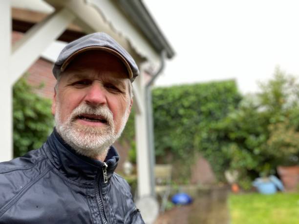 istock Senior Biker in the rain 1222248366