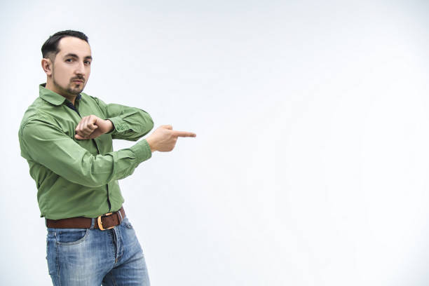 Man pointing and looking at camera