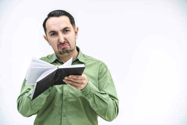 istock Disappointed young caucasian businessman reading documents, frowning his face, found mistake in report. 1222251165