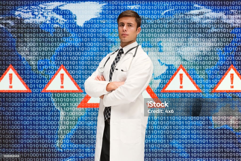 Young Male Computer Programmer Wearing Lab Coat And Using Computer ...