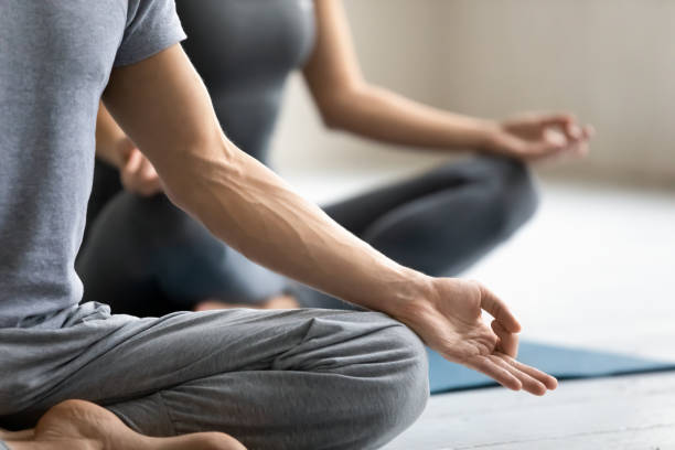 istock Meditation practice focus on male fingers folded in mudra symbol 1222252793