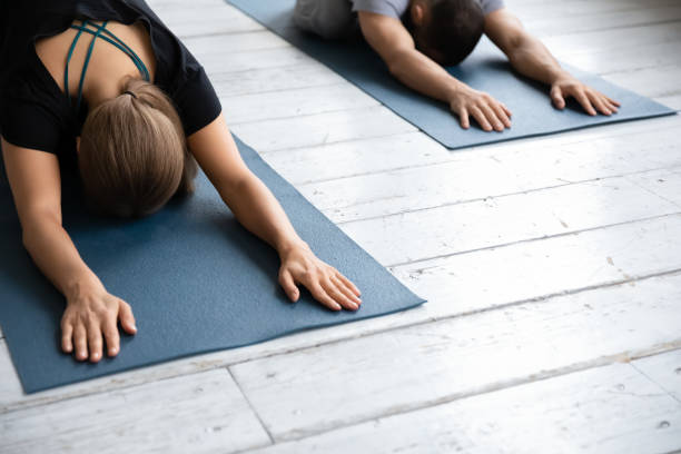 istock Closeup image woman performing Child Pose or Balasana during class 1222252852