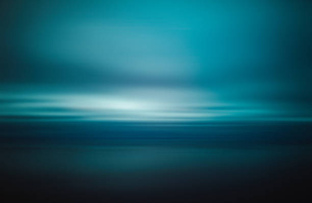 istock Moody and smooth empty sea and sky at blue hour 1222253744