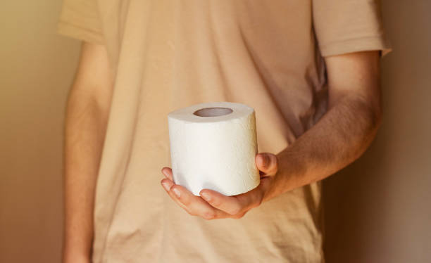 istock dirty hand picking a toilet paper 1222254024