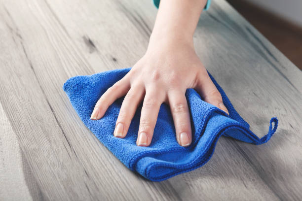 istock woman cleaning table 1222254492