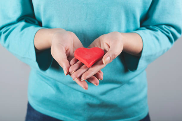 istock woman hand red heart 1222254495