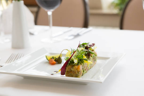 istock Fresh salmon tartare served with salad 1222254547