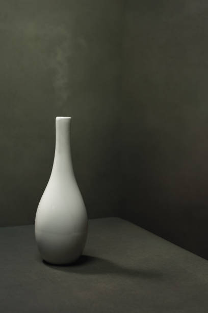 istock White pottery vase with smoke in gray empty space. 1222255626