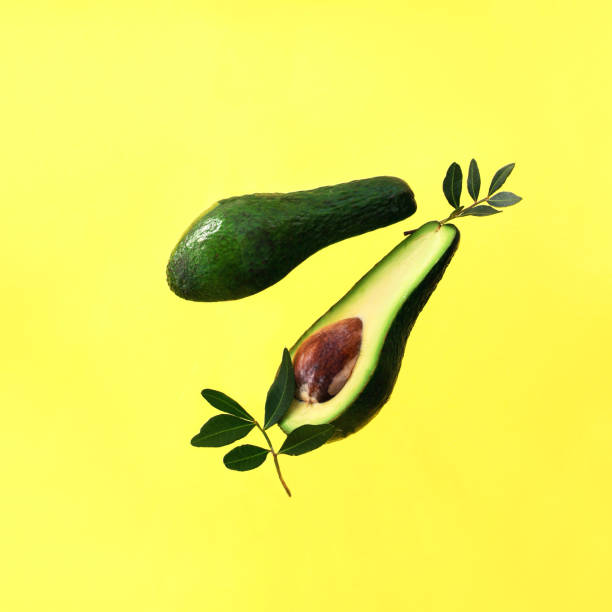istock Levitating avocado on the yellow background 1222257874