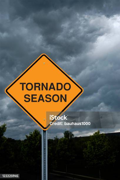 Warning Sign In Front Of Storm Clouds Stock Photo - Download Image Now - Cloud - Sky, Cloudscape, Color Image