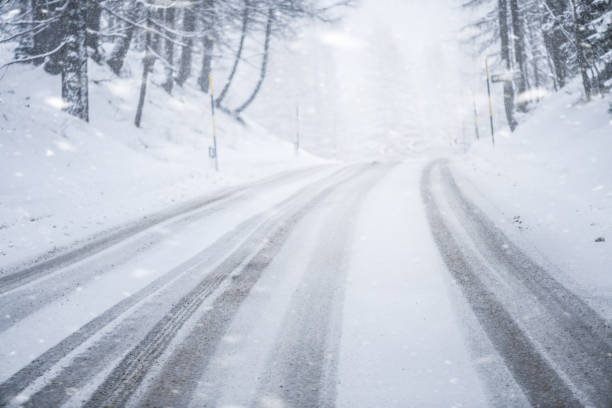 istock Winter snowy or calamity road in forest mountains. 1222260608
