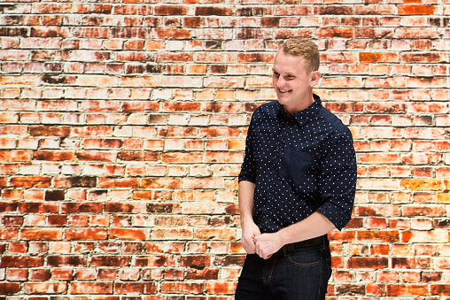 One person of aged 20-29 years old with short hair caucasian young male wearing shirt who is happy