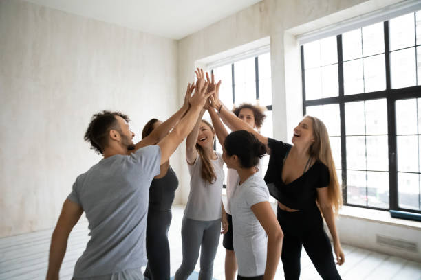 istock In modern studio happy people in sportswear giving high five 1222262977