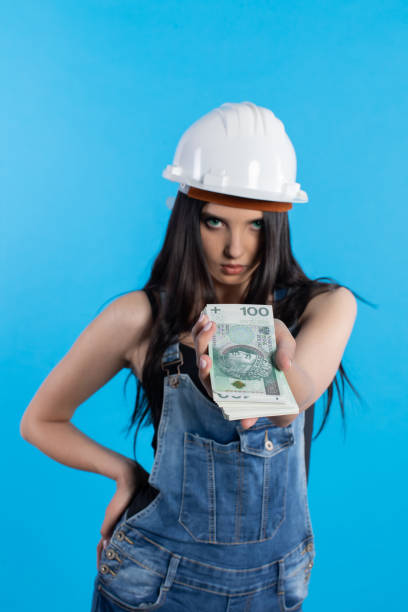 istock A young construction manager distributes banknotes to everyone who starts working together. 1222263541